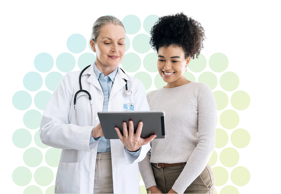 Doctor showing tablet to another women